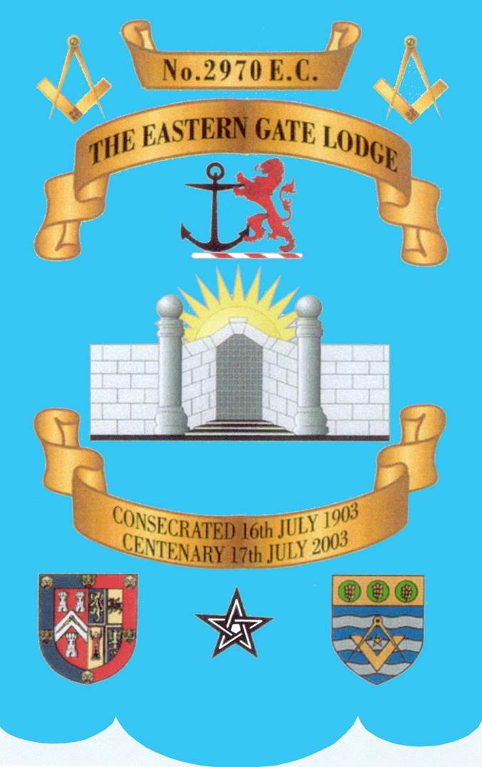 The lodge banner: on a blue ground, a gate in a stone wall between two pillars topped with globes, the sun rising behind it, the square and compasses and the District’s lion-and-anchor seal above, and scrolls reading No. 2970 E.C., THE EASTERN GATE LODGE, and CONSECRATED 16th JULY 1903, CENTENARY 17th JULY 2003, with two coats of arms and a pentagram at the foot.